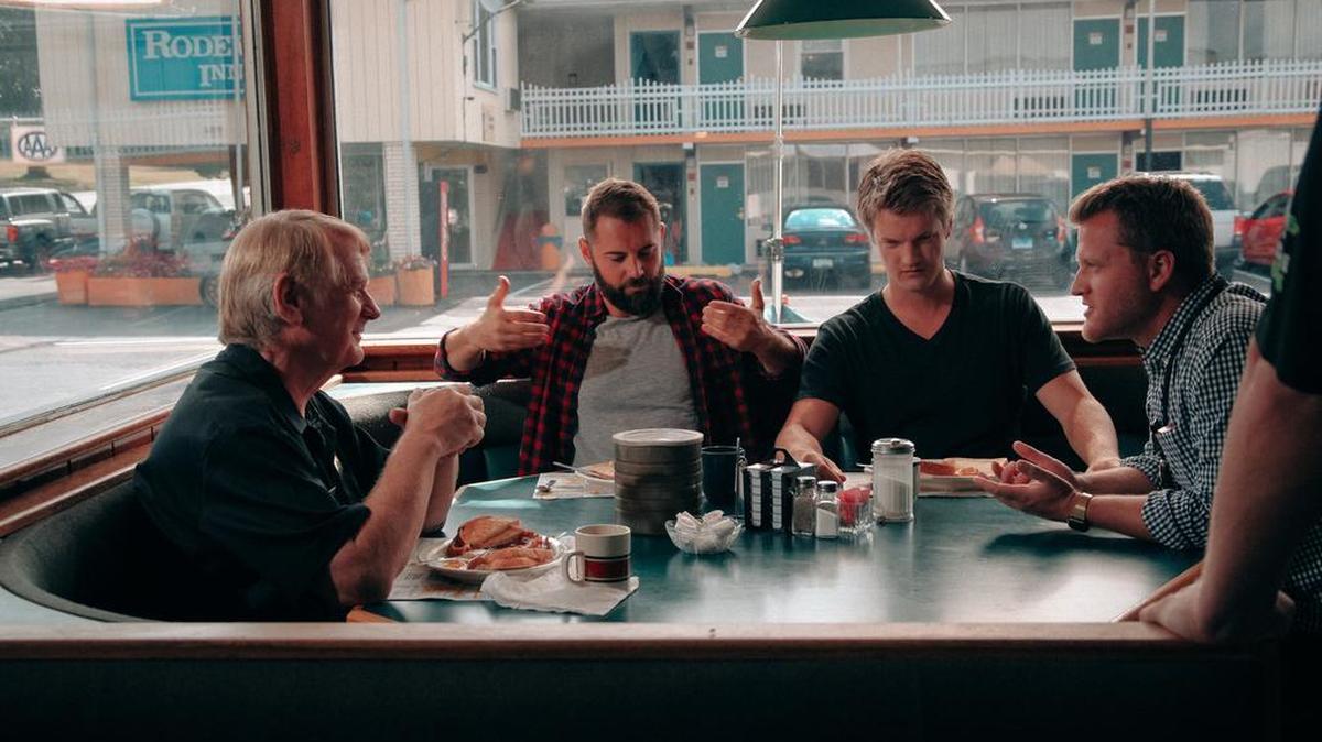 From left to right: actors Bill Farmer and Daniel MacPherson sit in a booth at the former Arrowhead Restaurant in Clearfield with co-writer Dax Spanogle and director/co-writer Spencer Folmar. The group was in Centre County last summer for production on the feature film “Generational Sins.”