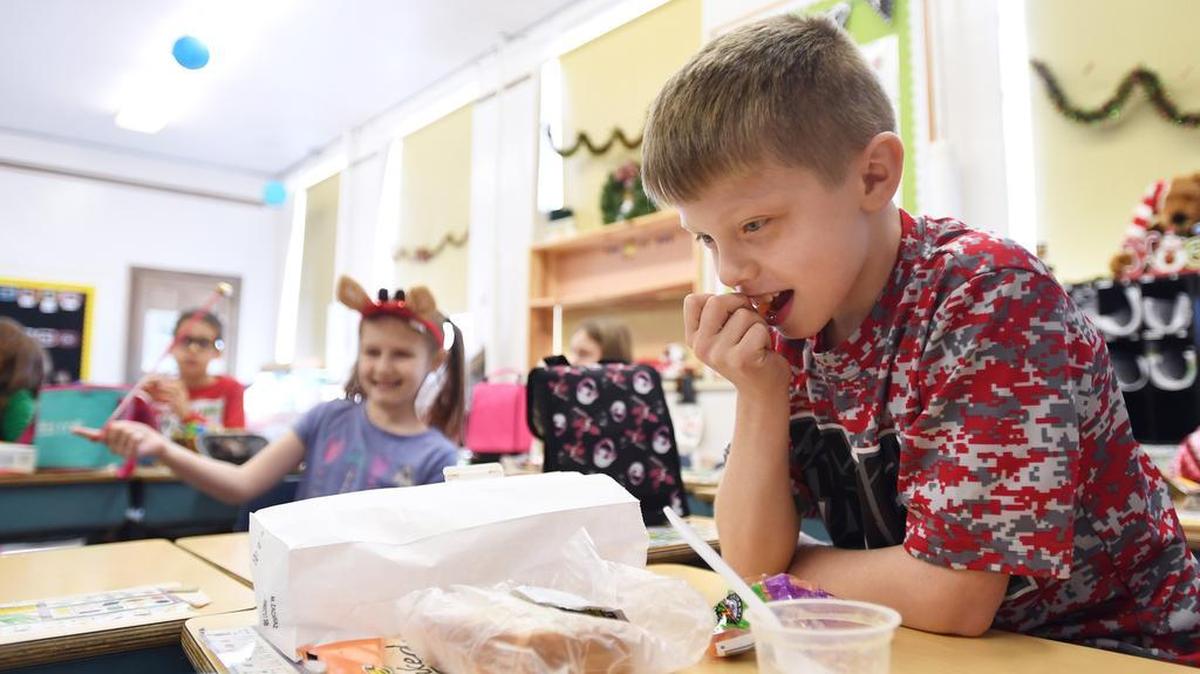 Blake Glace, 8, eats lunch during bagged lunch day Thursday, Dec. 21, 2017 at Bellefonte Elementary School.
