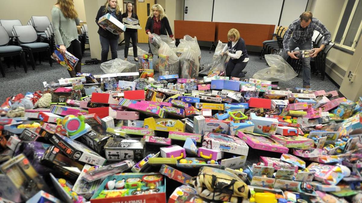 College of Engineering employees place Toys for Tots in a room for collection on Friday. The college raised about $3,200 and purchased all of the toys from Ollie’s with a 20 percent discount.