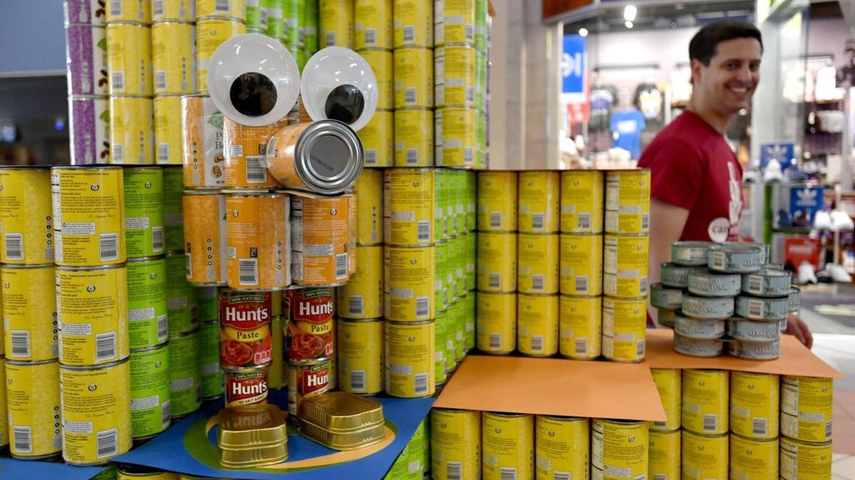 Barton Associates created the winning sculpture out of canned foods with the theme “Q*Bert” for the Canstruction State College at the Nittany Mall on Friday, April 28, 2017.