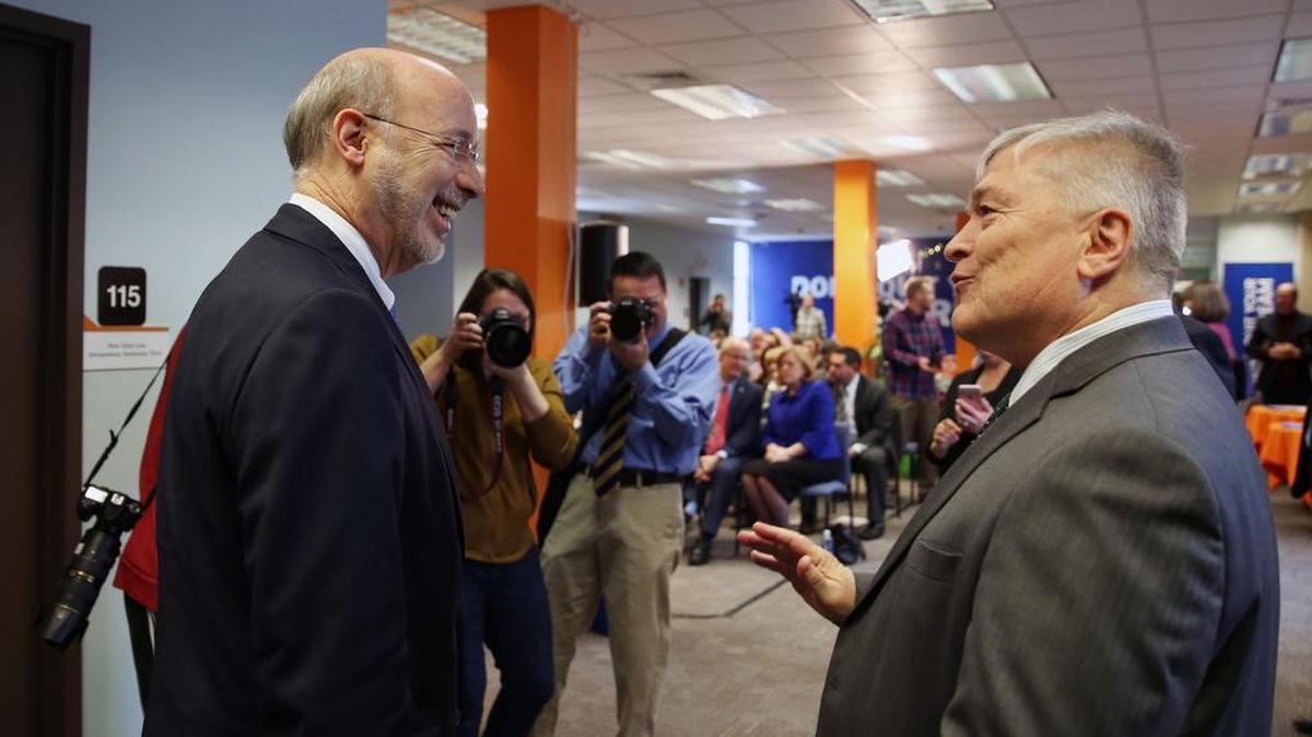 Gov. Tom Wolf, left, and Penn State President Eric Barron speak at Happy Valley LaunchBox in State College on Monday. The governor visited before the co-working space to speak how entrepreneurship and innovation factor into his 2017-2018 state budget proposal.