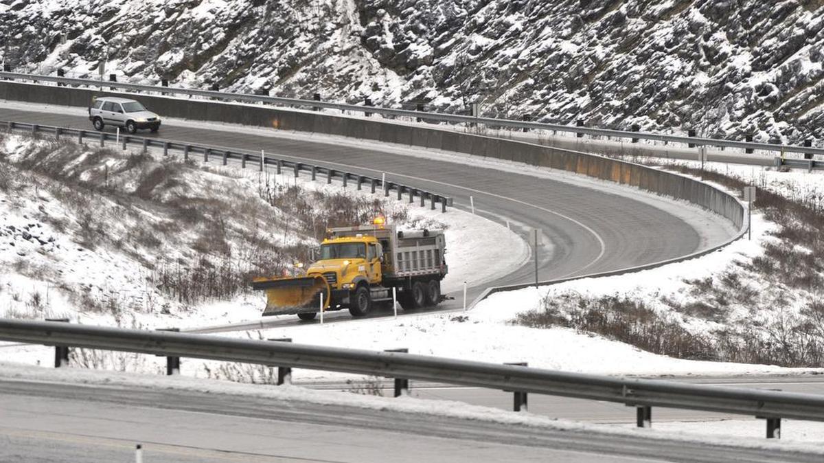 A PennDOT truck puts salt down on ice covered roads at the Grays Woods interchange in State College in 2011.