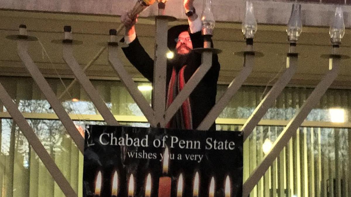 The menorah is lit Tuesday in State College.
