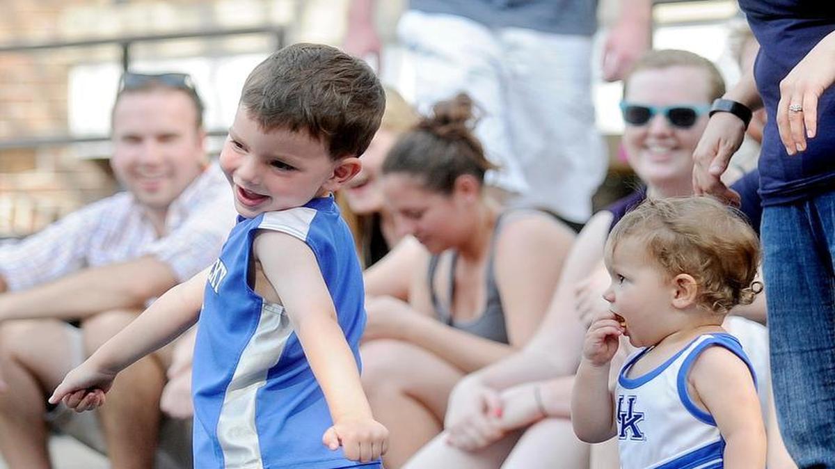 Luca Brajuha, 4, dances with his sister, Ellie, 1, as they listen to Biscuit Jam on the Calder Way stage during the Summer’s Best Music Fest in 2013.