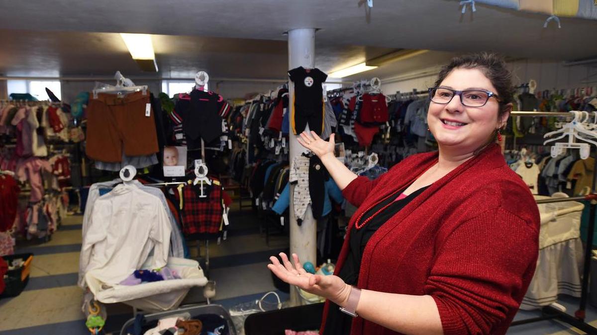 Pastor Renee Ford talks about the Mommy Shoppe during The Houserville Christmas Market and Food Fair Sunday at the Houserville United Methodist Church.