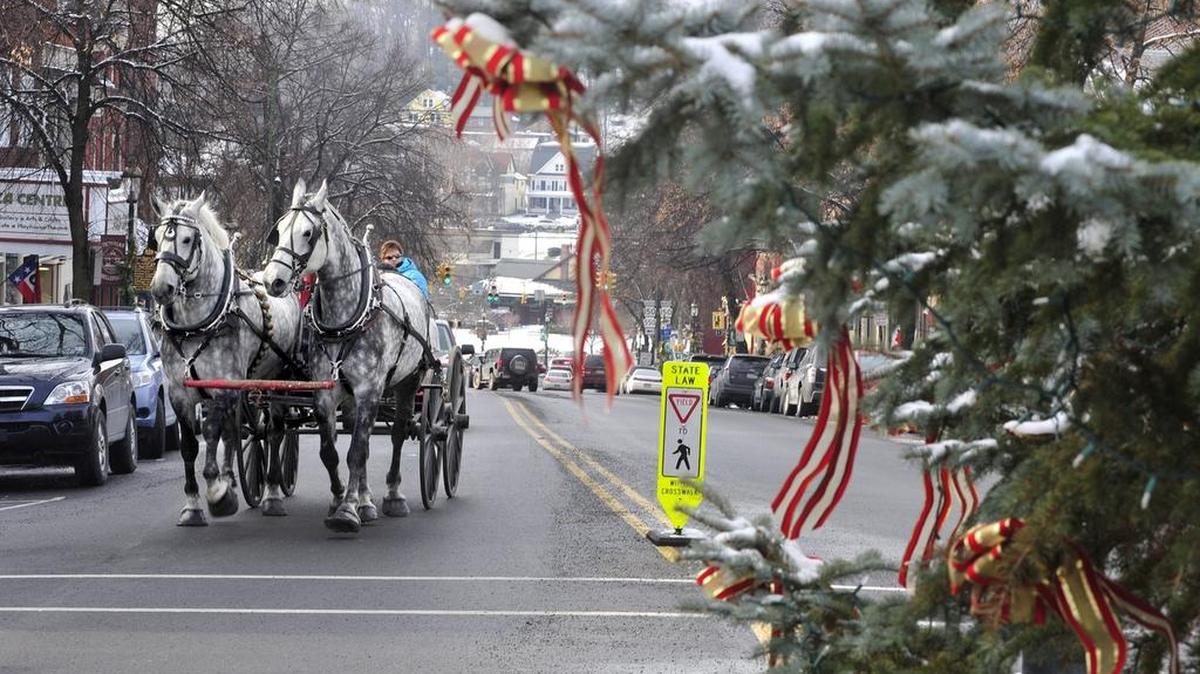 People enjoy Horse Drawn Carriage Ride as part of Bellefonte’s annual Victorian Christmas.
