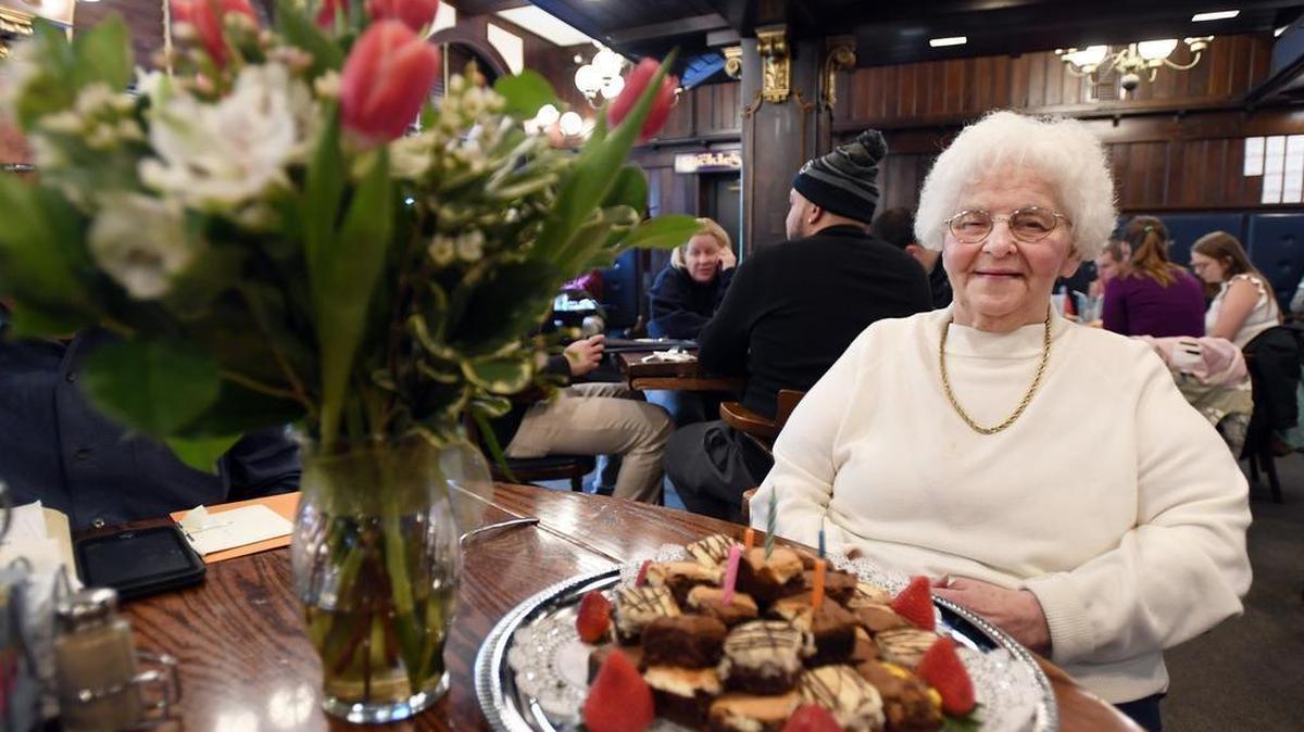 Emma Gunsallus sits for a portrait during her last day on the job Tuesday at The Corner Room in State College. Gunsallus has been a waitress at the restaurant for 61 years.