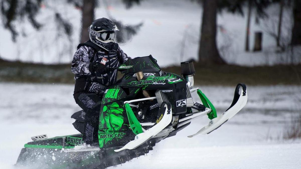 Caleb Heitzenrater rides up the hill while practicing Sunday before the Snowmobile Hill Climb Racing Association event at Tussey Mountain.