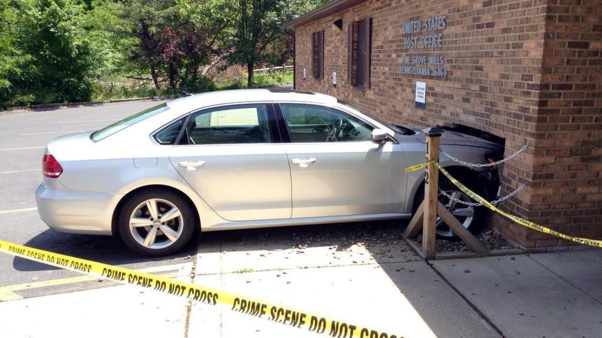A car struck the Pine Grove Mills post office at about noon Sunday, when the operator reportedly pressed on the accelerator instead of the brake pedal, according to police.