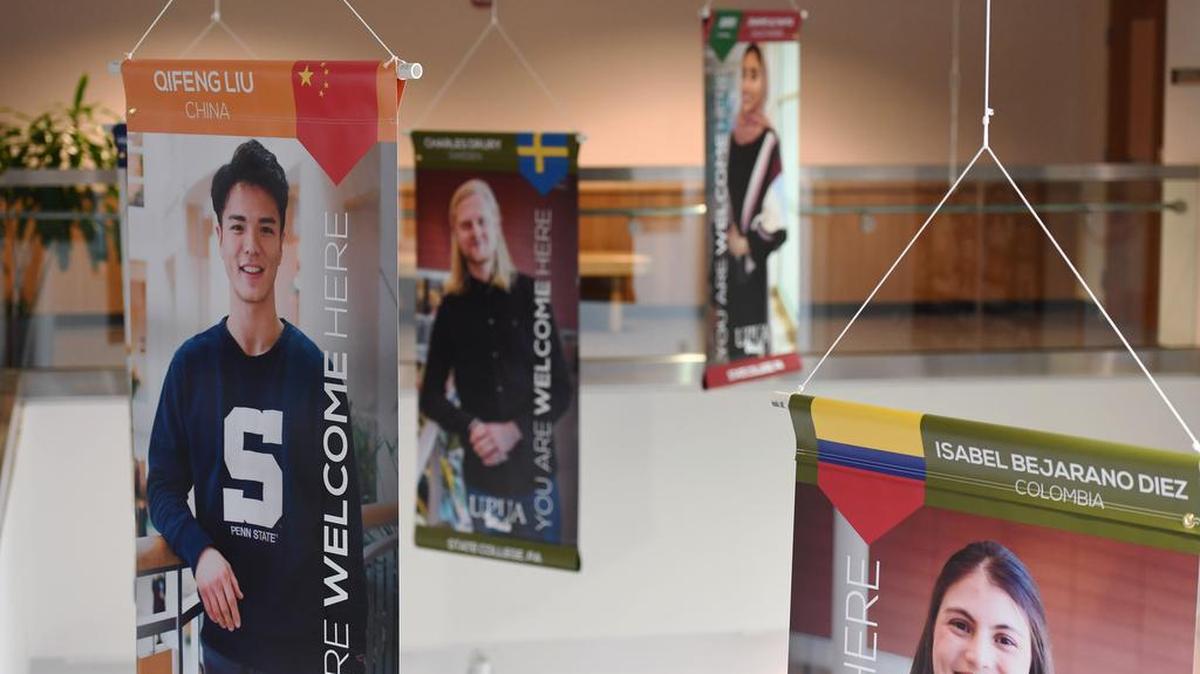 Banners are displayed in the State College Municipal Building during the “You Are Welcome Here” banner unveiling ceremony Monday, April 2, 2018.