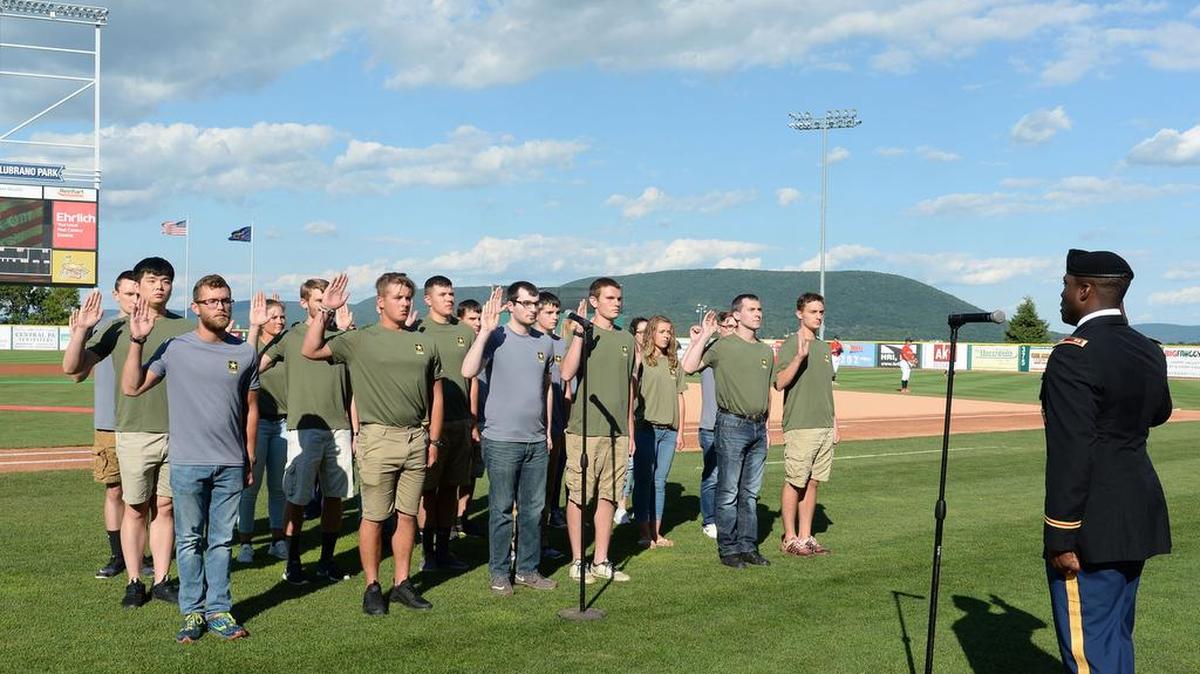 U.S. Army Capt. John Laird, of the State College Recruiting Company, swears in applicants for Active and Reserve duty in the U.S. Army prior to Sunday’s State College Spikes game against the Auburn Doubledays at Medlar Field at Lubrano Park.