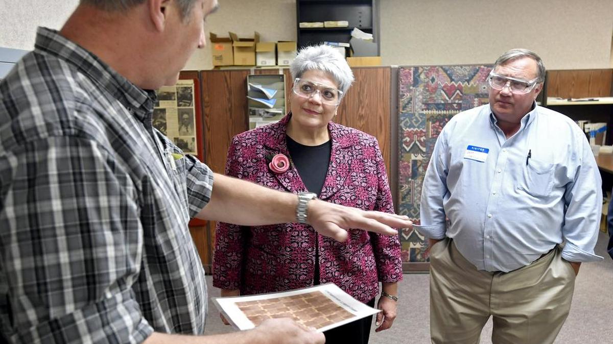 Department of Labor and Industry Secretary Kathy Manderino listens to Ken Gawryla as he talks about circuits that are made using Chemcut equipment on Thursday, October 27, 2016. Manderino stopped at Chemcut as part of her “Jobs That Pay” tour.
