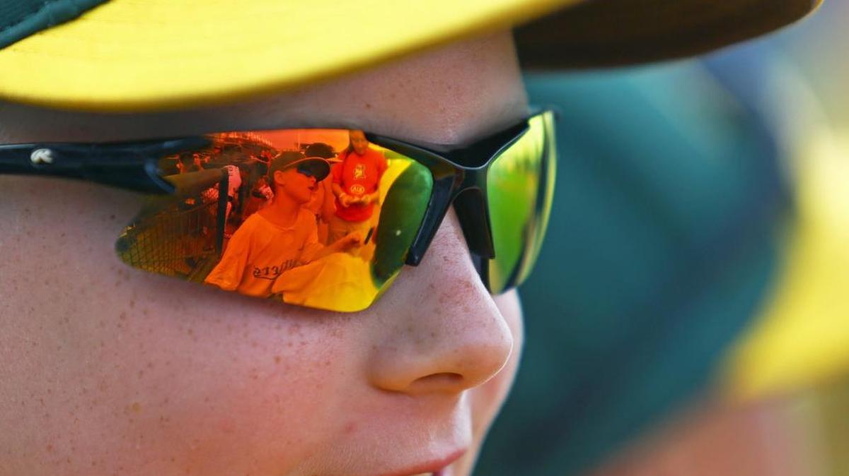 Zach Mazer waits by the home dugout at Medlar Field at Lubrano Park with the Centre County Cutters 8U team to run onto the field with the State College Spikes’ starting lineup on Monday. “Baseball is such an important part of summertime,” said Spikes Manager of Communications Joe Putnam.