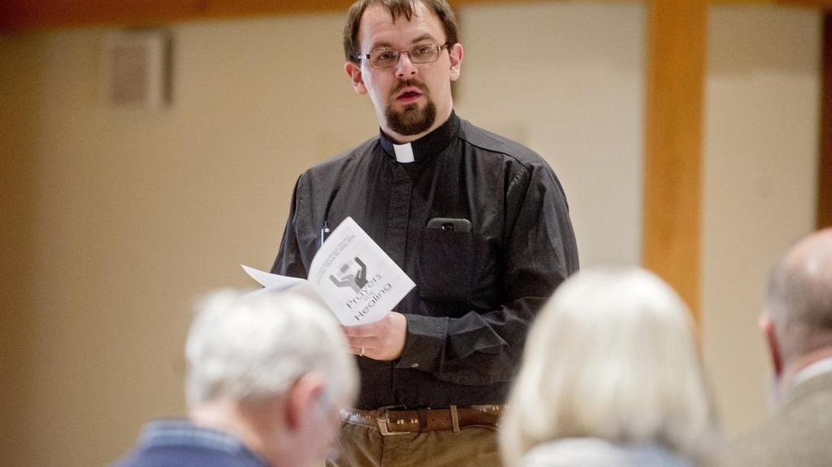 Pastor Paul Tomkiel reads a Psalm during the Community Prayer Service at St. Paul Lutheran in Pine Grove Mills on Saturday.