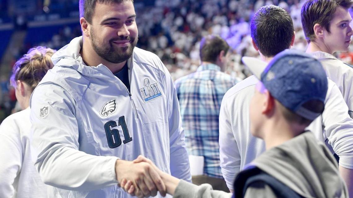 Penn State football standout and Philadelphia Eagles Super Bowl champion Stefen Wisniewski greets fans before the Penn State men’s basketball game against Ohio State on Thursday.
