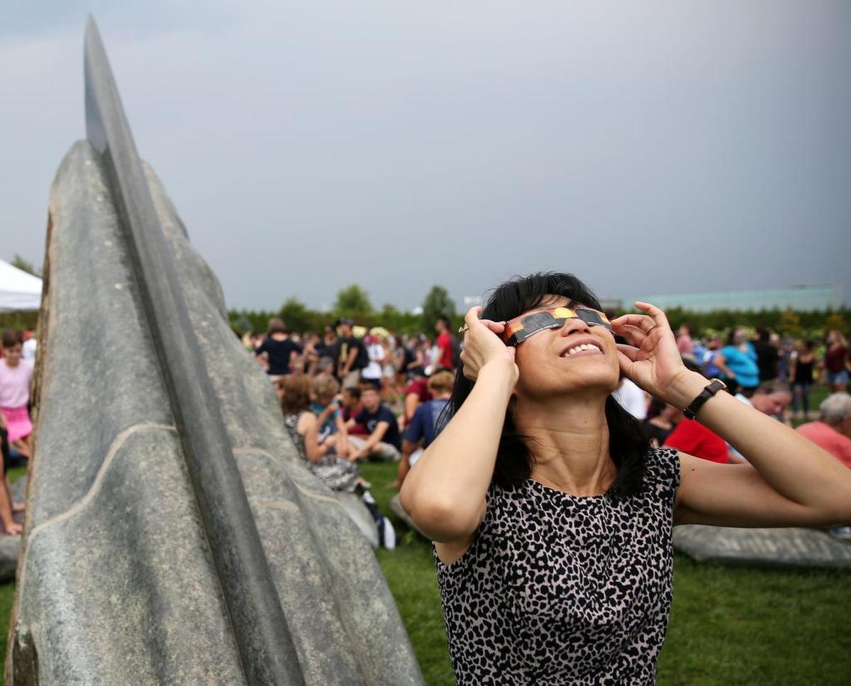 Cindy Li looks at the eclipse Monday, Aug. 21, 2017 at The Arboretum at Penn State.