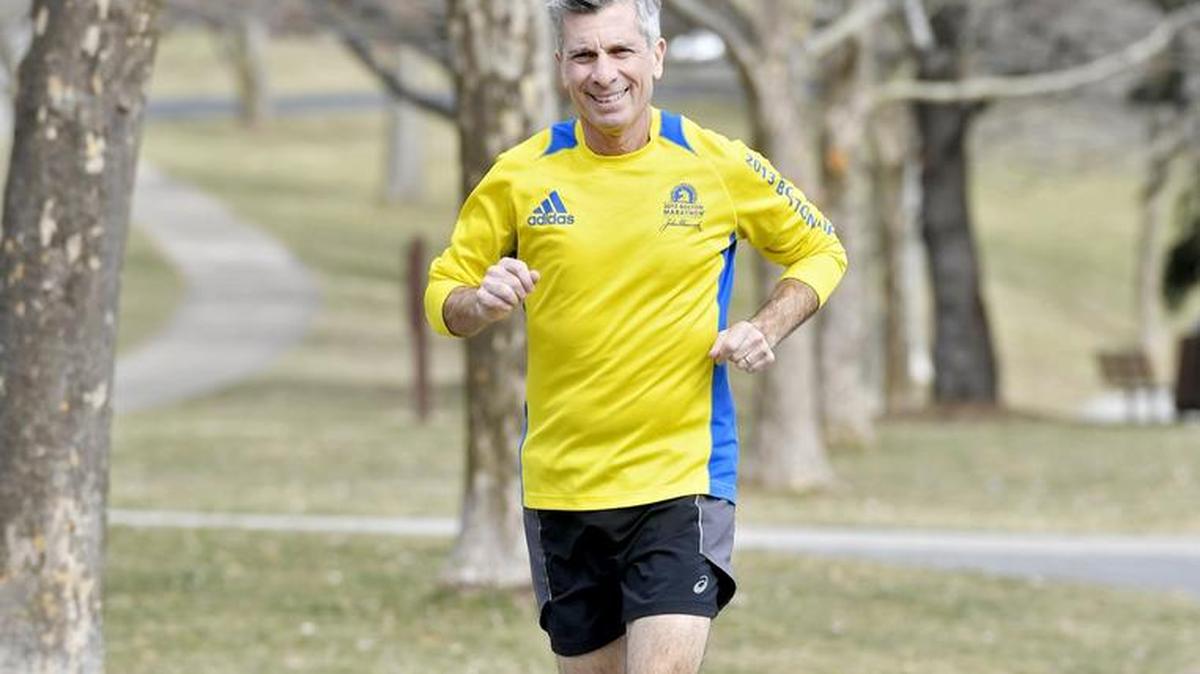 Tom Cali runs through Orchard Park in State College. Cali is a local real estate agent and runner who sponsors many charity runs around town.