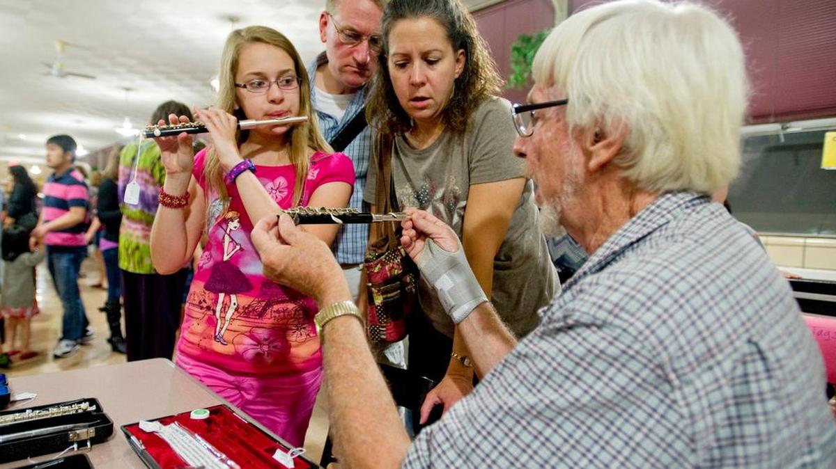 Megan Russell, 12, tests out a piccolo during the State College Area School District Music Boosters Used Instrument Sale in 2014. This year’s sale will be held 7-9 p.m. Wednesday in the high school’s North Building cafeteria.