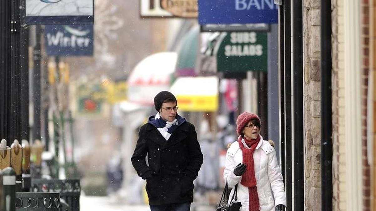Denise Reynolds and her son, Marc Reynolds, of Seattle, window shop in downtown State College in 2013.