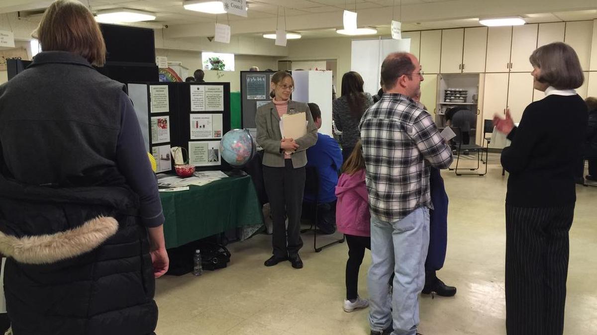 People peruse booths at the Alternative Christmas Fair to showcase local nonprofits at University Baptist and Brethren Church in State College on Sunday.
