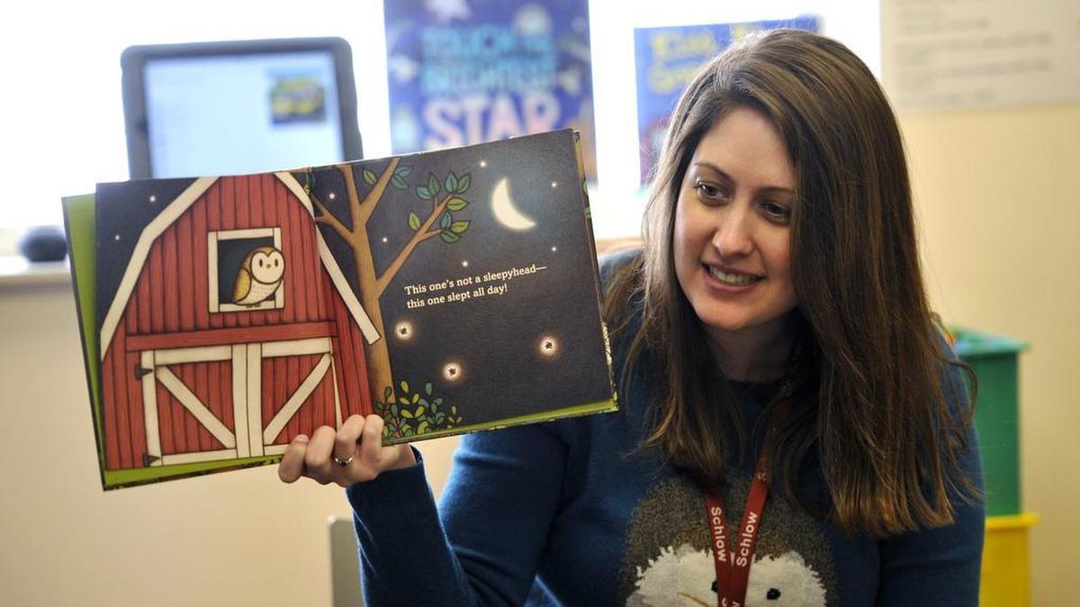 Children’s librarian Paula Bannon reads a story last month at Schlow Centre Region Library. The library has introduced an app for managing library cards and linking to library services.