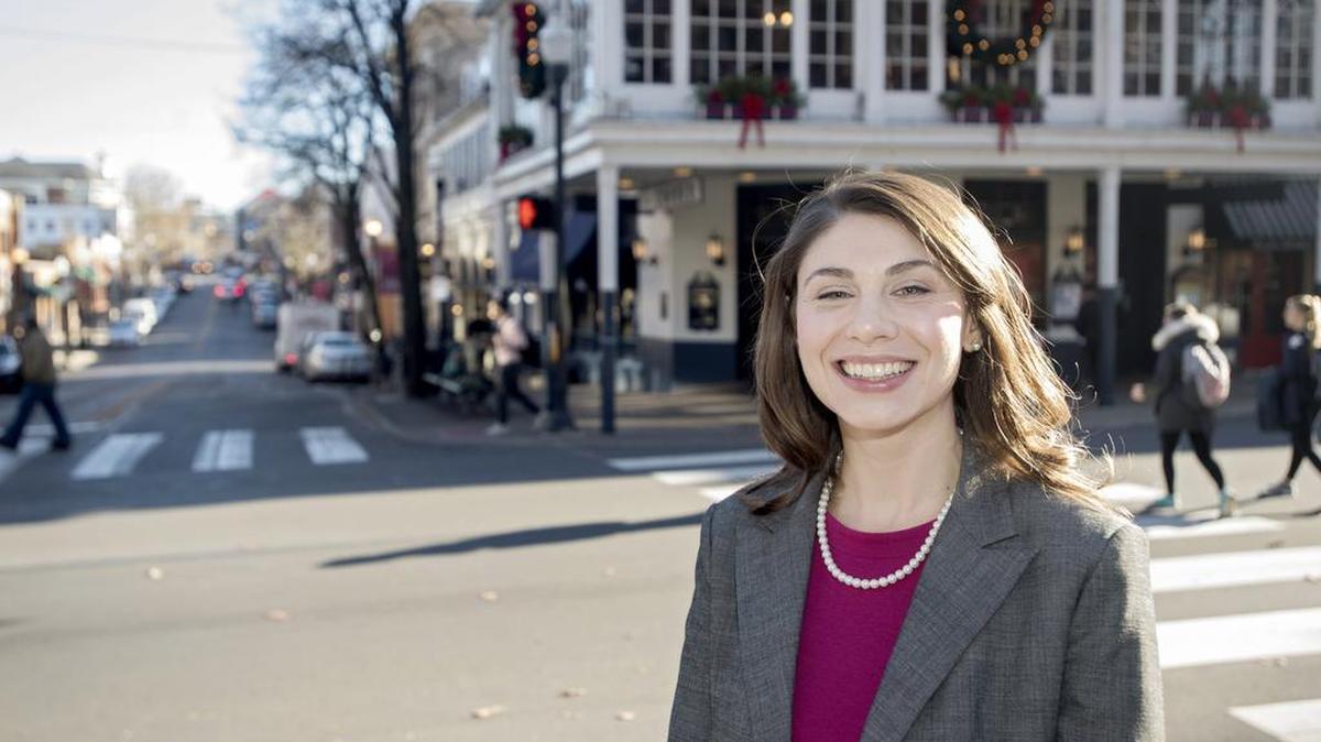 Irene Miller, new executive director of the Downtown State College Improvement District, stands along College Avenue on Wednesday.