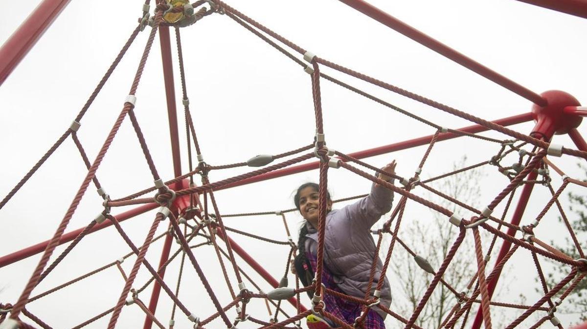Uma Sood, 9, climbs a rope obstacle to reach a golden Easter egg on Sunday at Blue Springs Park in Boalsburg. The annual egg hunt is coordinated by Zion Lutheran Church and St. John’s United Church of Christ.