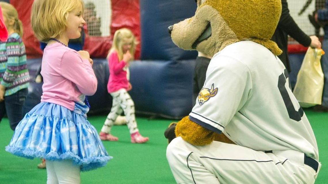 Trinity Semack, 4, meets Ike the Spike at the 10th annual SpikesFest on Sunday at the Penn State Multi-Sport Facility.