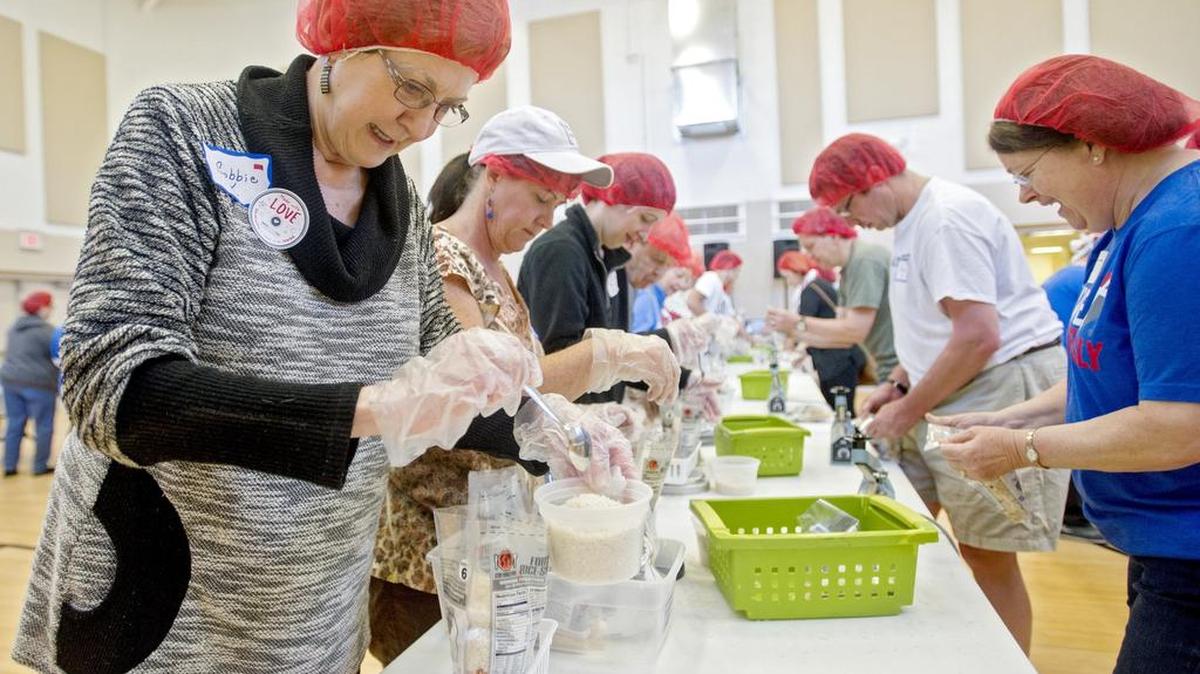 Barbara Korner adds some rice to a bag. Volunteers from Grace Lutheran Church and St. Paul’s United Methodist Church join together on Saturday to pack meals for the Stop Hunger Now campaign.