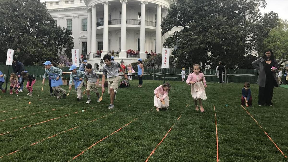 Gabrielle Jones, 5, and Elizabeth Jones, 8, participate in the White House Easter Egg Roll on Monday.