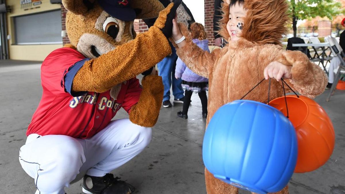 Takumi Takano, 3, high-fives Ike the Spike during Sunday’s Safe & Seen at the Ballpark at Medlar Field at Lubrano Park.