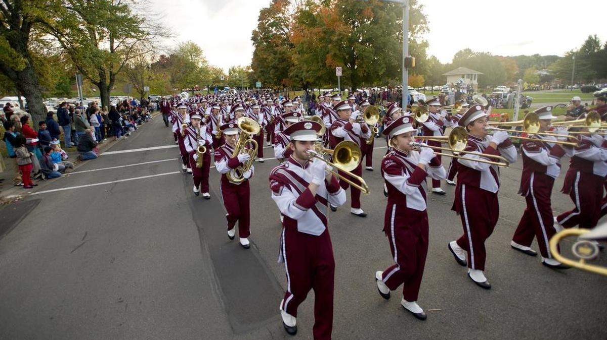 The State College Area High School Marching Band makes its way down Westerly Parkway for the 2014 homecoming parade.