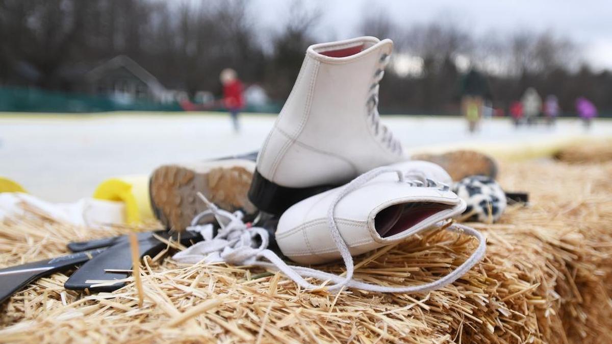 Skates and shoes sit by the Blue Spring Park ice rink during the 2018 Winter Carnival in Boalsburg.