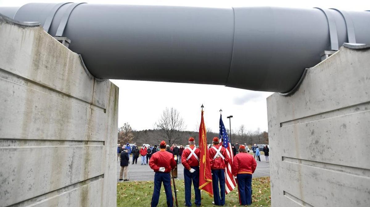 A Pearl Harbor Remembrance Day tribute is held Thursday next to the guns from the USS Pennsylvania at the Pennsylvania Military Museum.