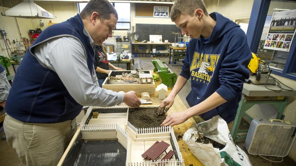 Bald Eagle teacher Todd Biddle works with student Logan Fetzer while making a landscape box on Dec. 15 to present at the Pennsylvania Farm Show. Biddle was invited to accompany Rep. Glenn Thompson to President Barack Obama’s State of the Union address Tuesday evening.