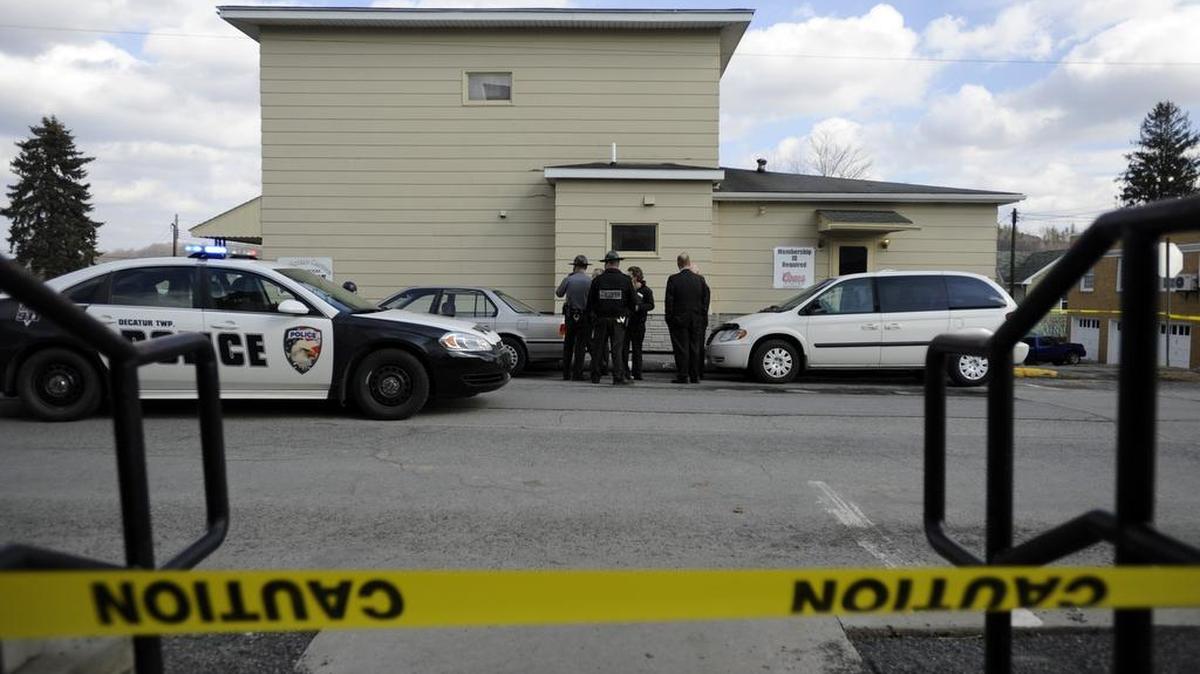 Police investigate the scene of a shooting outside of a VFW hall in Osceola Mills on Wednesday, April 1, 2014.