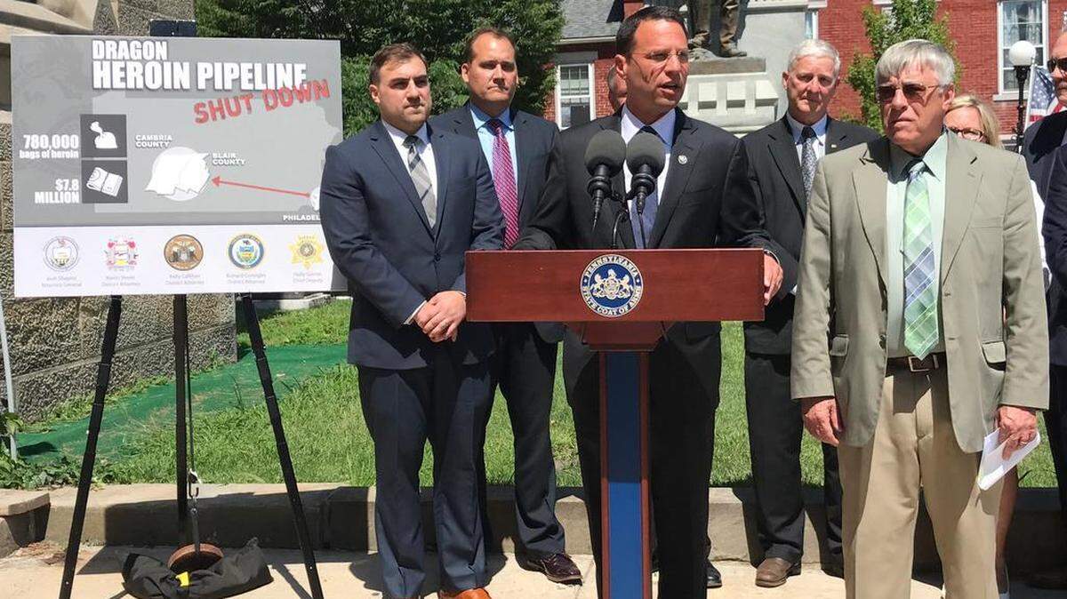 Pennsylvania Attorney General Josh Shapiro, center, flanked by, from left, Cambria County Assistant District Attorney Arnold Bernard; state Sen. Wayne Langerholc, R-Johnstown; state Rep. Bryan Barbin, D-Johnstown; and Blair County District Attorney Rich Consiglio, announces charges against 16 people in connection with a drug-trafficking ring he says distributed and sold $7.8 million worth of heroin in the Johnstown and Altoona areas.