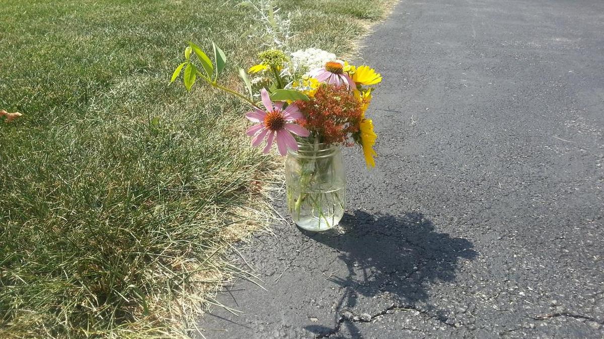 Flowers were placed outside the Kudlach home in College Township after Nuria Kudlach was shot in August 2015.