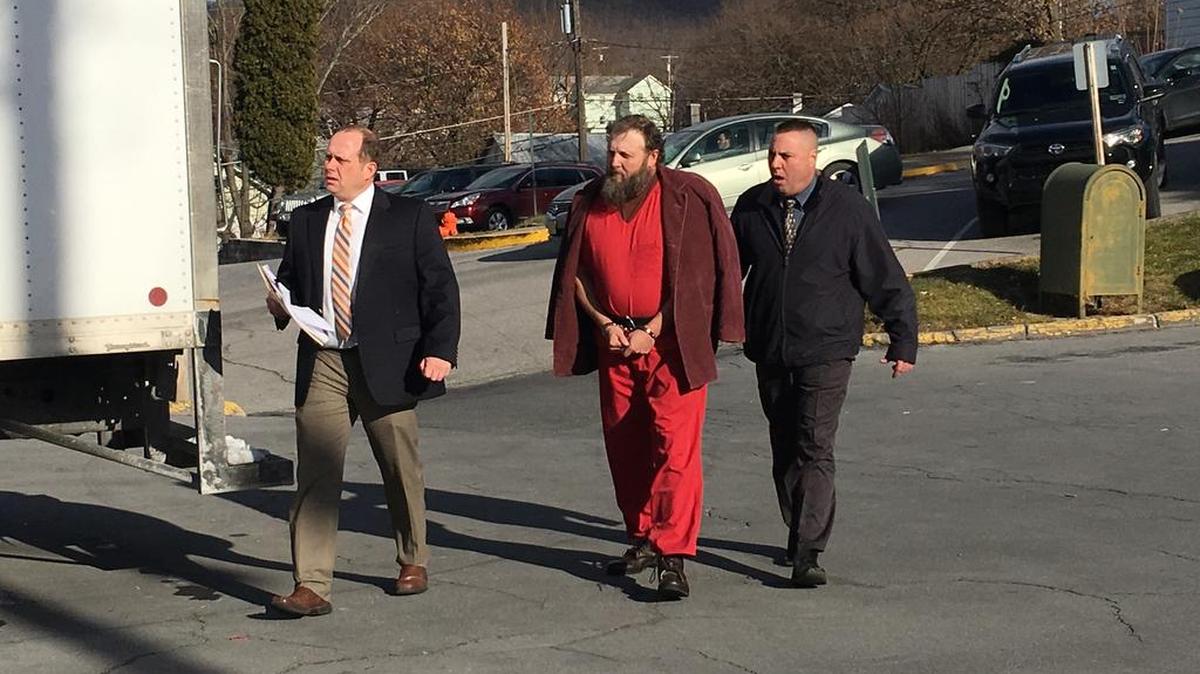 Franklin Furl III is led to court Wednesday morning in Bellefonte for a preliminary hearing on the reported Snow Shoe police shootout.
