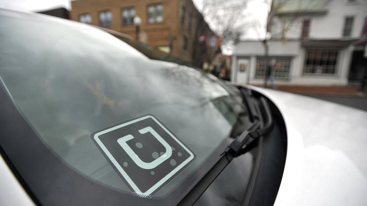 Every Uber driver has a decal on their window with the logo.