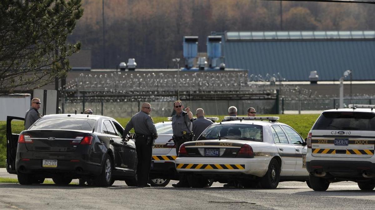 State police gather outside SCI Houtzdale in April 2015 after an inmate riot that left several staff members injured.
