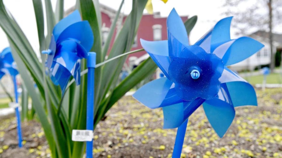Blue ribbons and pinwheels in Osceola Mills brought awareness for child abuse after a couple was charged with aggravated assault on their 3-week-old daughter.