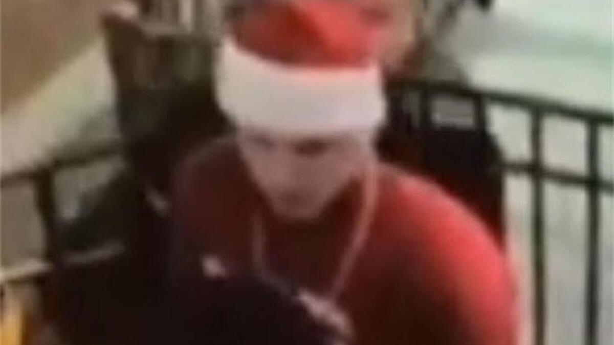A man wearing a Santa hat and red sweater pulled a knife on others, according to State College police.