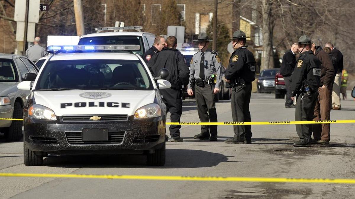 Police investigate the scene of a shooting outside of a VFW hall in Osceola Mills on Wednesday, April 1, 2014.