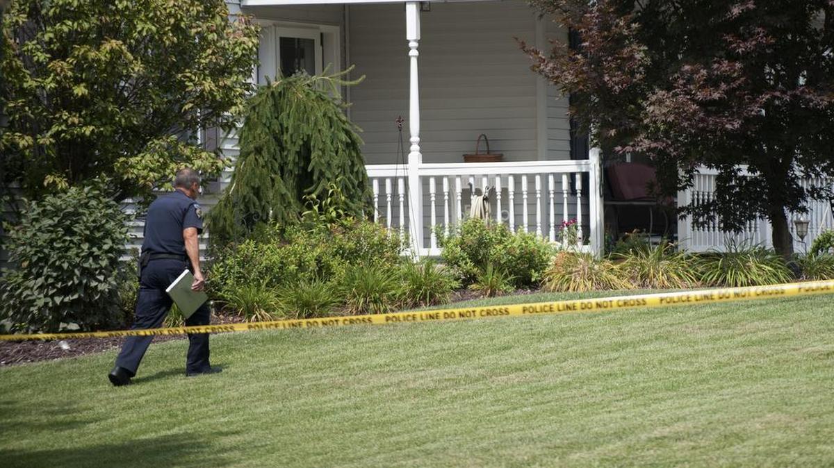 Police investigate the scene of the fatal shooting of Nuria Kudlach in August 2015.