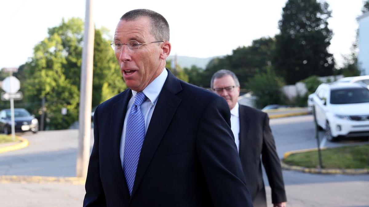 Former Penn State assistant athletic director Tim Bream walks to the Centre County Courthouse in August. A  a private criminal complaint has been filed against Bream, alleging that he lied under oath when asked about Beta Theta Pi's alcohol use.