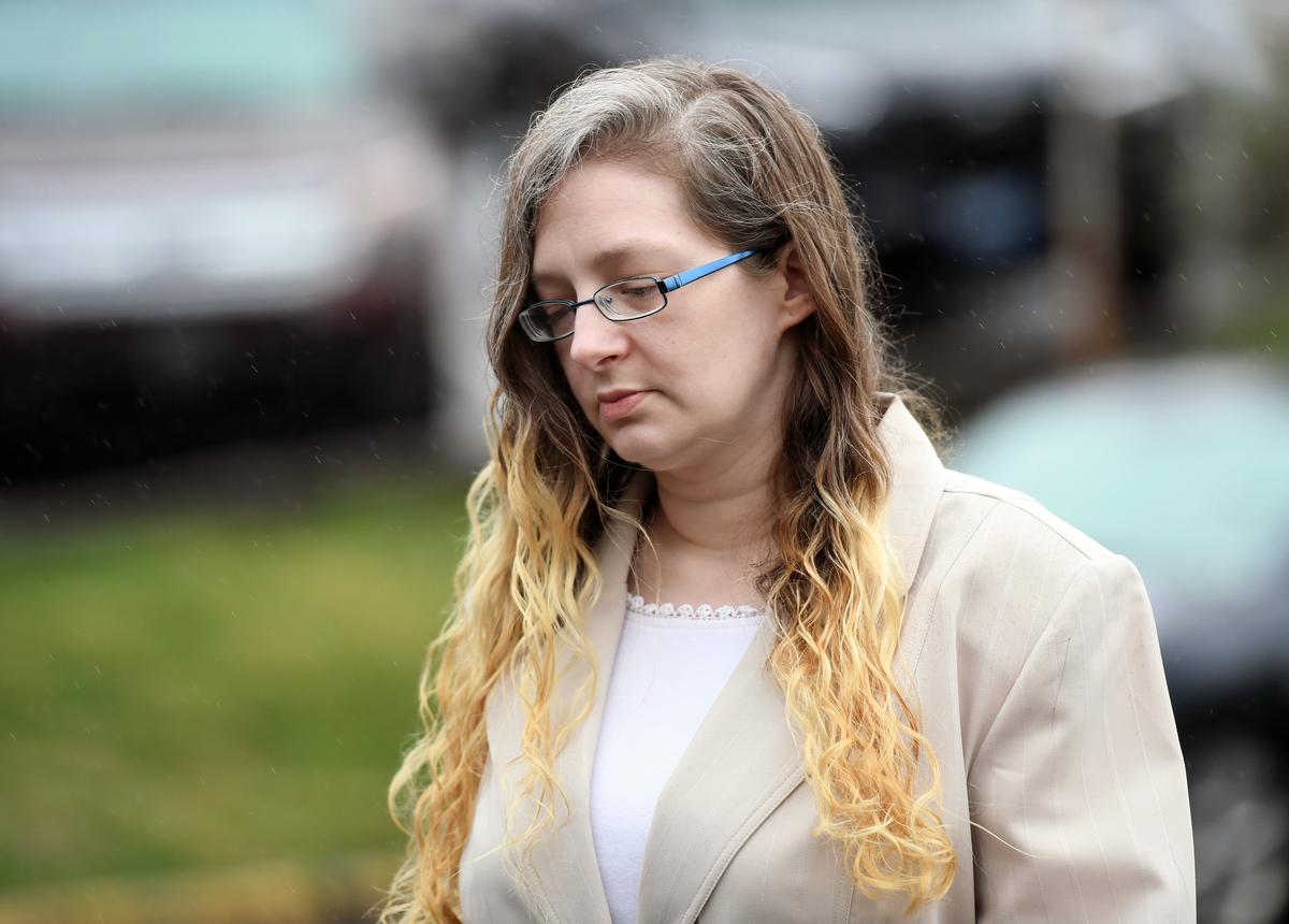 Danelle Geier walks toward the courthouse for the murder trial for Ronald Bettig on Monday, April 16, 2018, at the Centre County Courthouse.