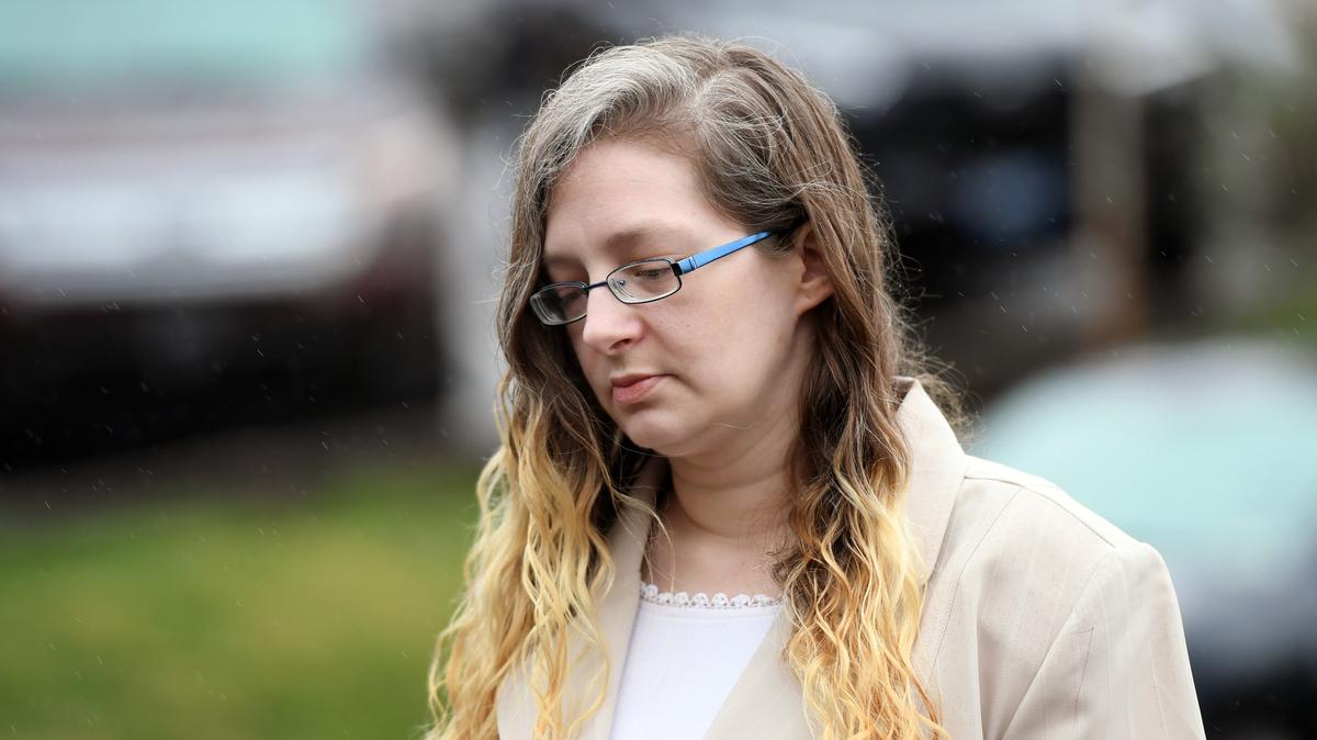 Danelle Geier walks toward the courthouse for the murder trial for Ronald Bettig Monday, April 16, 2018 at the Centre County Courthouse.