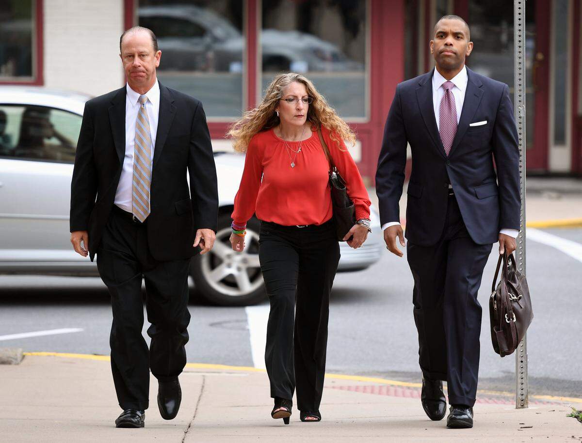 Jim and Evelyn Piazza walk toward the Courthouse Annex for former Beta Theta Pi fraternity member Ryan Burke’s sentencing  on Tuesday, July 31, 2018 in Bellefonte.