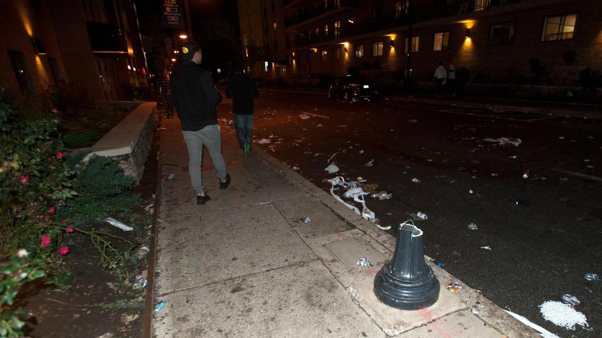 A view of a broken lamppost and leftover debris after a riot broke out after the Penn State game Saturday, Oct 22, 2016 on East Beaver Ave.